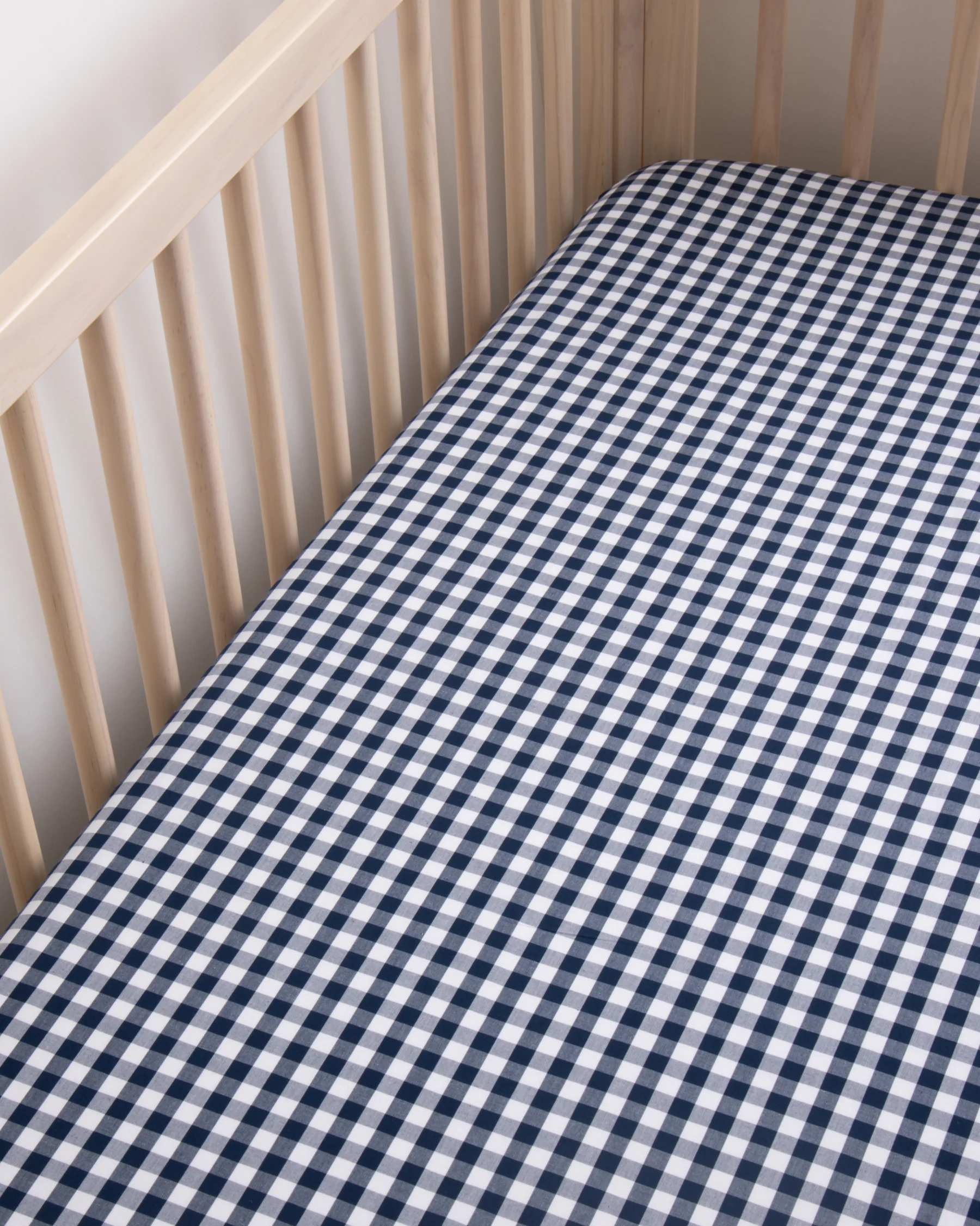 Luxe Premium Percale Crib Sheet in Navy Gingham - Image 3