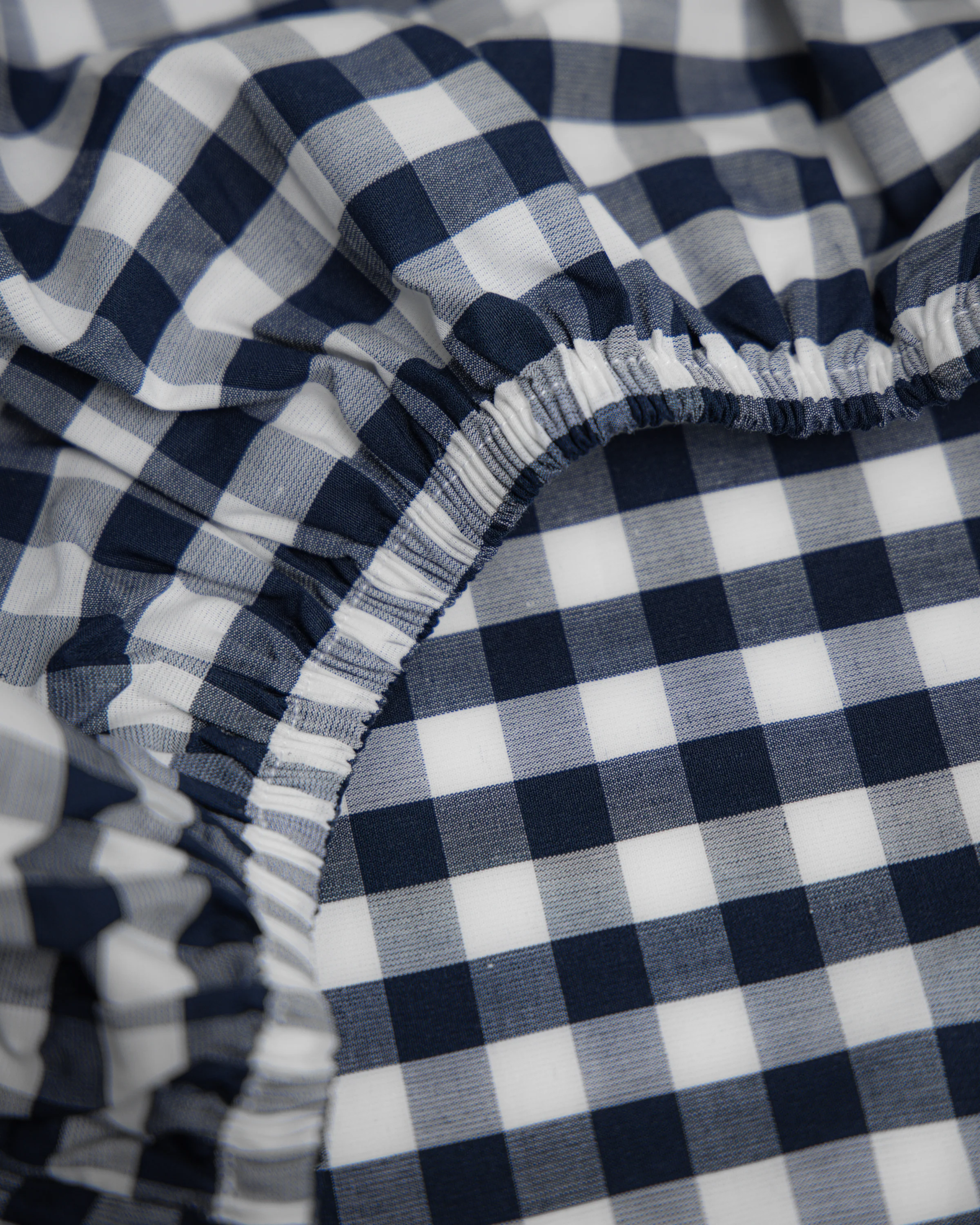 Luxe Premium Percale Crib Sheet in Navy Gingham - Image 4